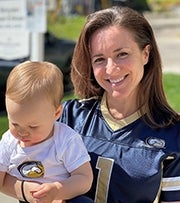 Jenni and child in UC Davis shirts