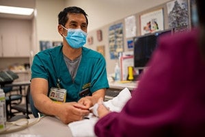 Doctor helping patient