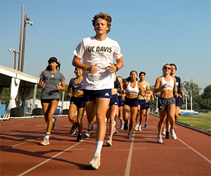 Group of people running on track