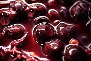 Close up of grapes in juice as they are being transformed to wine