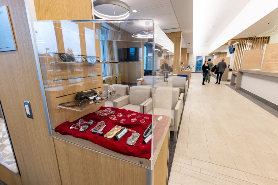 Common areas in the Ernest E. Tschannen Eye Institute Building contain display cases with antique ophthalmology tools and eyewear.