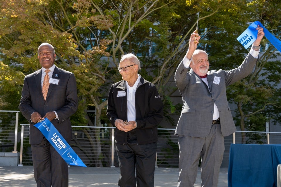 Chancellor May on the left, Ernest E. Tschannen in the middle, and Mark J. Mannis on the left at the dedication of the new Ernest E. Tschannen Eye Institute Building on September 17, 2022.