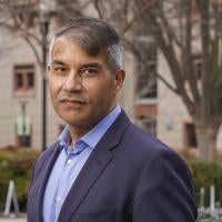 Ravinder Khaira in front of the science lecture building at UC Davis campus.