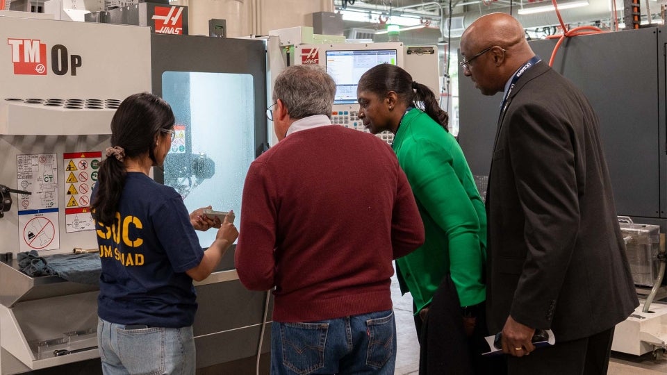 Nidhi Perugupalli demonstrates a CNC machine in the Engineering Student Design Center. (Katherine Hung/UC Davis)