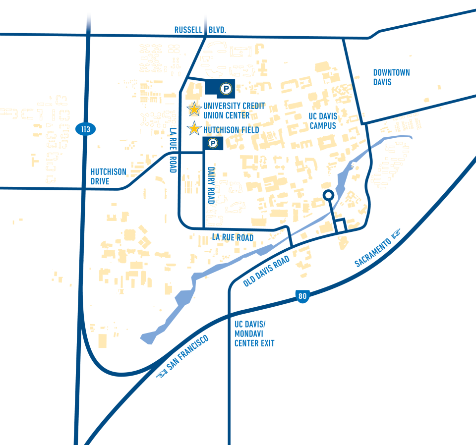 A stylized map focusing on a specific area, with various shades of blue and white representing different zones. Prominent labeled roads include Russell Blvd., Hutchison Drive, La Rue Road, and Old Davis Road. Notable locations marked are University Credit Union Center, Hutchison Field, and UC Davis Campus. The map also outlines a river or water body along the right side of the UC Davis Campus.