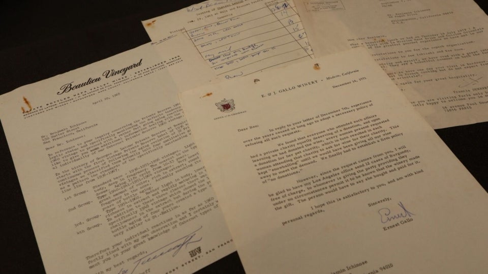Historic papers laid out on a desk.