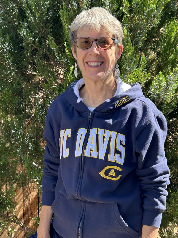 Michelle Nichols smiling wearing her UC Davis sweatshirt
