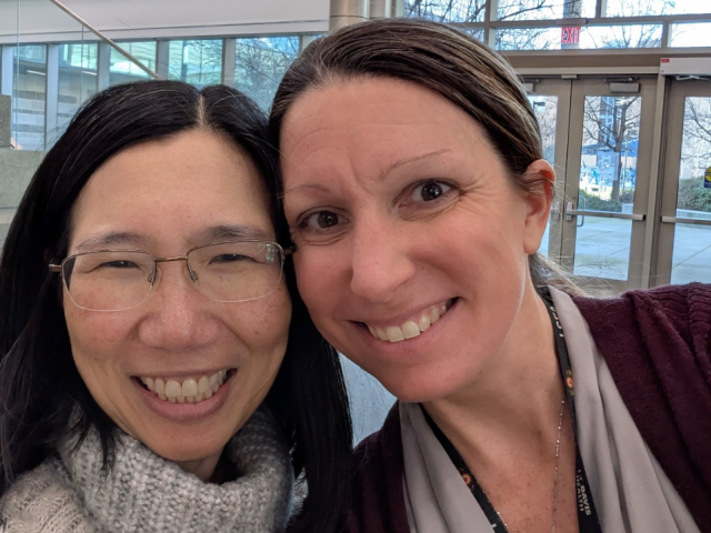 Chen-Nee Chuah, Child Family professor in Engineering and co-director of the UC Davis AI Center in Engineering, and Brittany Dugger, leader of the UC Davis Neuropathology Core and associate professor at UC Davis Health, pose in the atrium of the Betty Irene Moore School of Nursing at UC Davis Health.