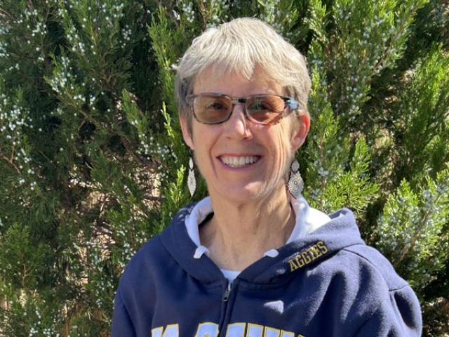 Michelle Nichols smiling wearing her UC Davis sweatshirt