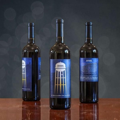 Three bottles of Alumni III, a 2022 Napa Valley Cabernet Sauvignon released by the UC Davis alumni wine club, Aggies Uncorked.