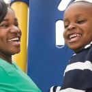 adult and child at playground