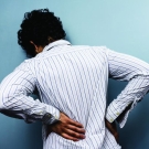 Man experiencing back pain 